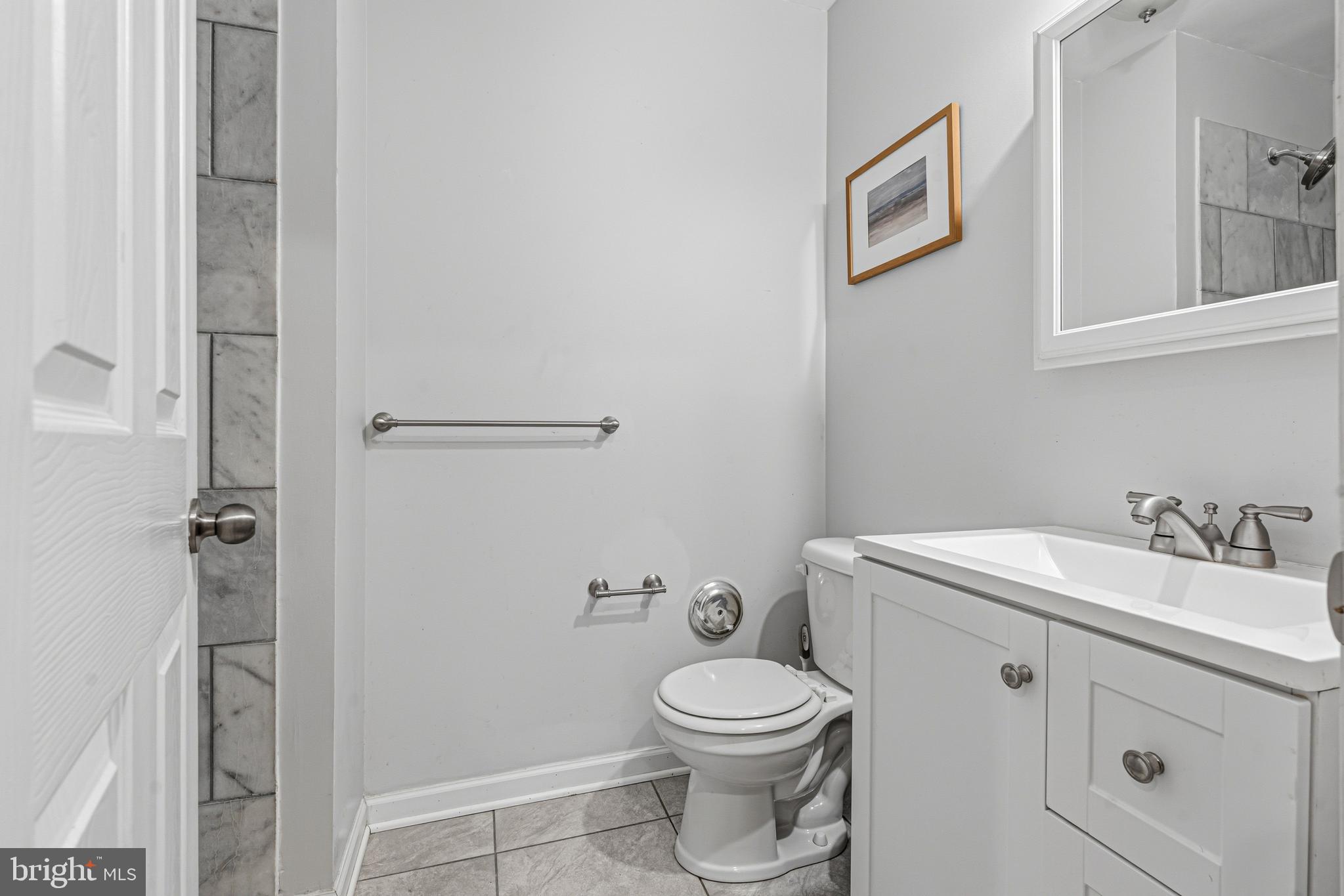 617 English Ivy Way Aberdeen, MD 21001 - Photo 26 of 35 a bathroom with a toilet a sink and shower