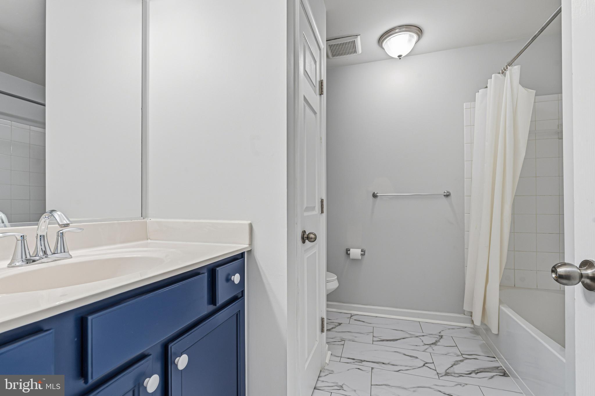 617 English Ivy Way Aberdeen, MD 21001 - Photo 29 of 35 a bathroom with a sink and a mirror