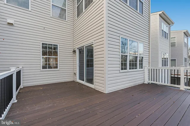 a view of a house with wooden deck