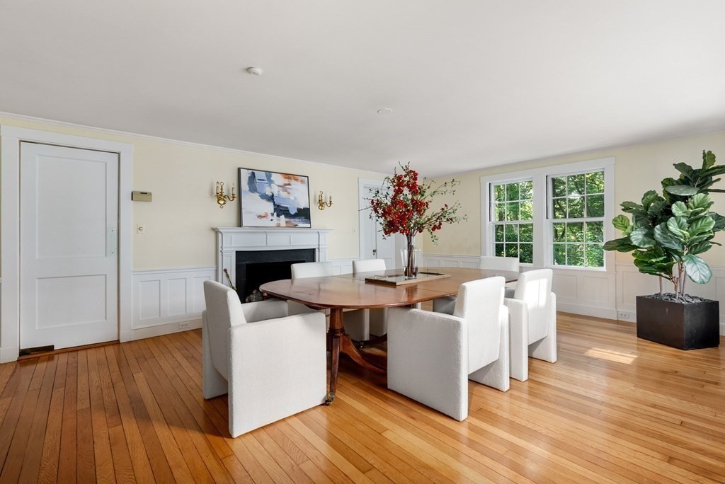 209 Meadowbrook Road Weston, MA 02493 - Photo 14 of 32 a living room with furniture a potted plant and a large window