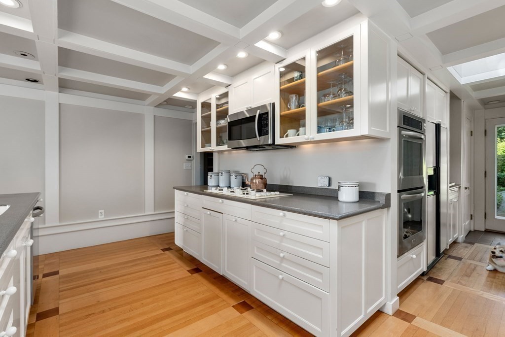 209 Meadowbrook Road Weston, MA 02493 - Photo 17 of 32 a kitchen with stainless steel appliances granite countertop a stove and a sink