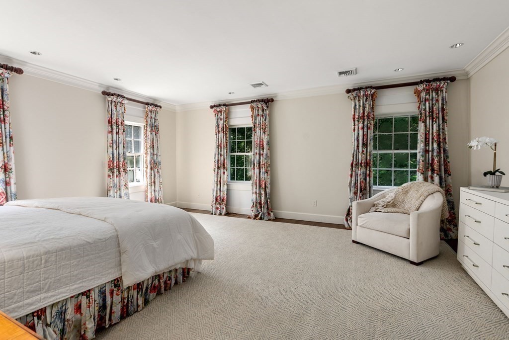 209 Meadowbrook Road Weston, MA 02493 - Photo 20 of 32 a bedroom with a bed couch and windows