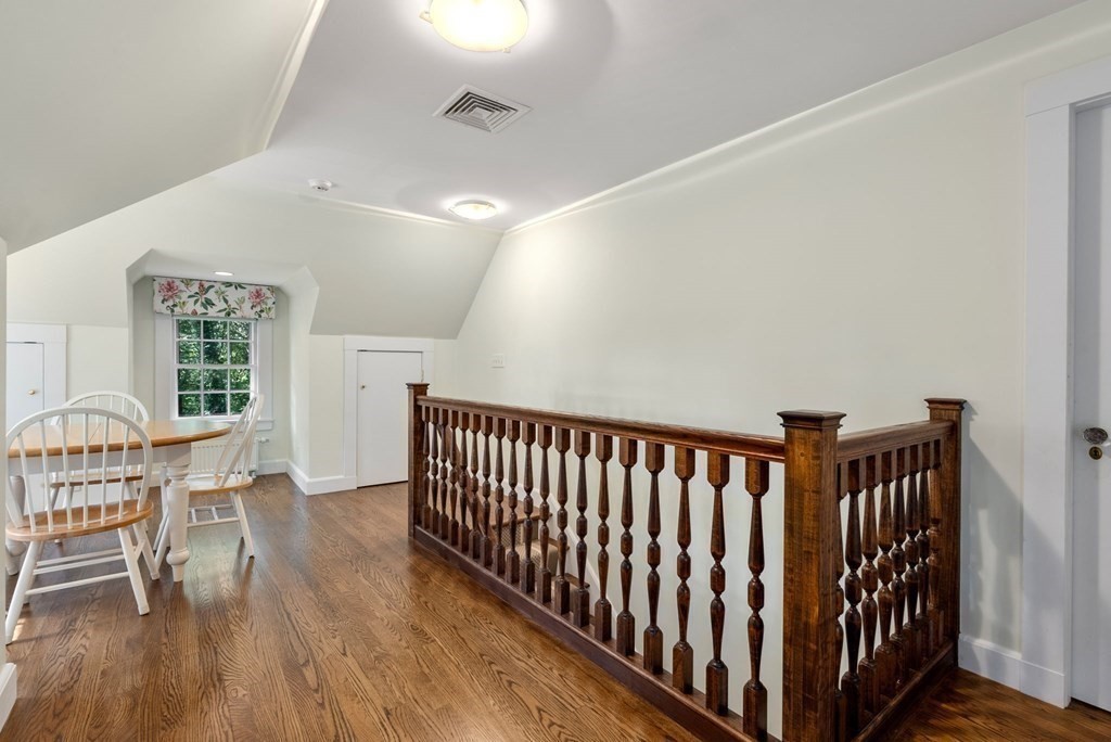 209 Meadowbrook Road Weston, MA 02493 - Photo 26 of 32 a view of a hallway with wooden floor and a window