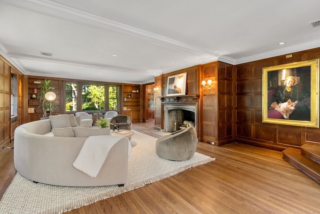 209 Meadowbrook Road Weston, MA 02493 - Photo 10 of 32 a living room with furniture a fireplace and a large window