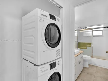 a view of a bathroom with a washer and dryer
