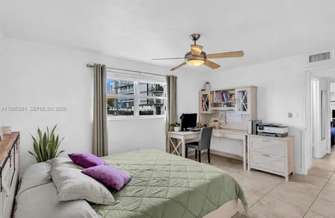 a bedroom with a bed furniture and a window