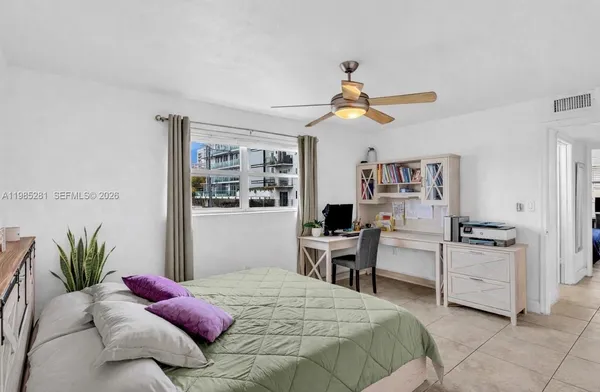 a bedroom with a bed furniture and a window