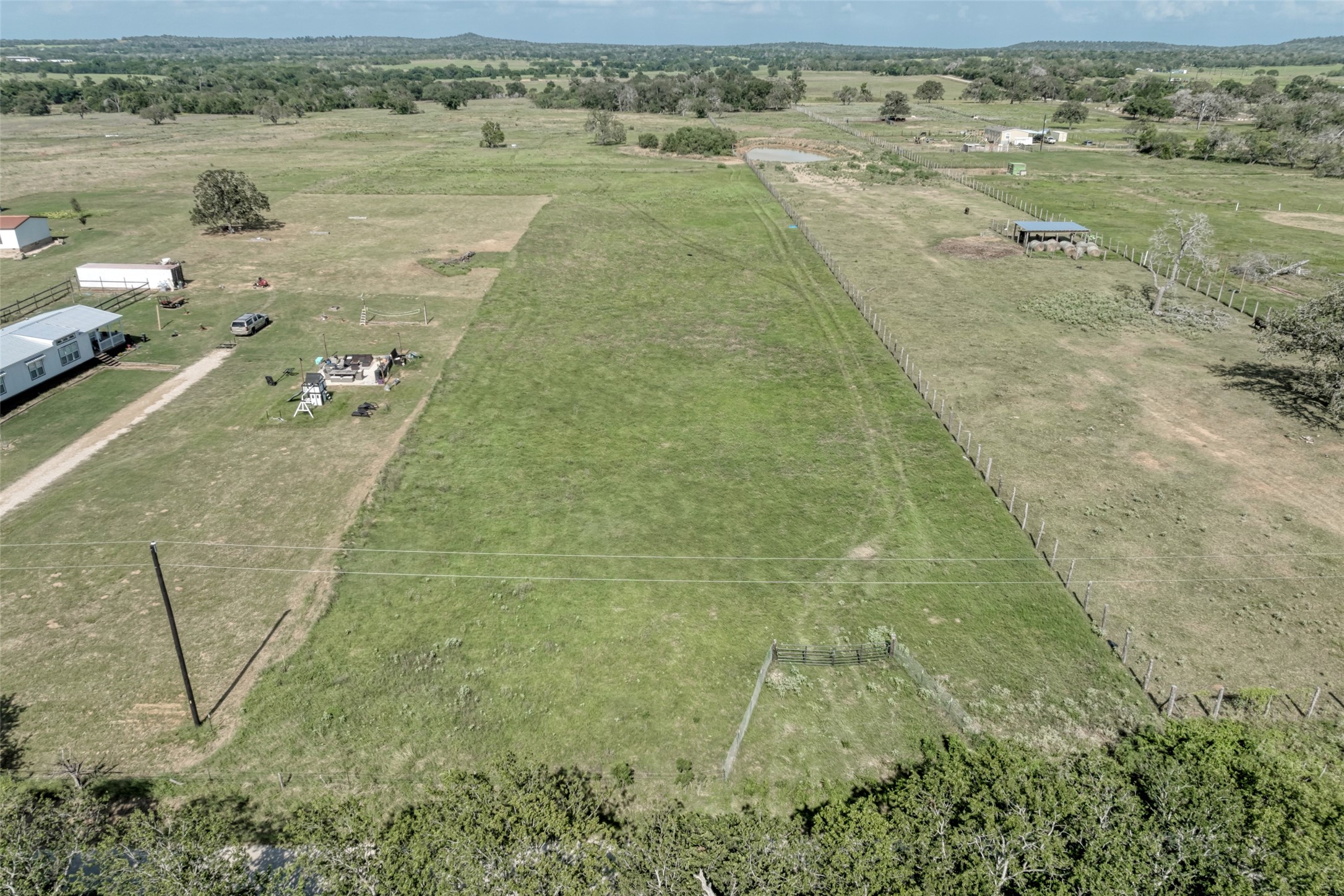 5309 Tenney Creek Road Luling, TX 78648 - Photo 8 of 23 Panoramic views abound across this generous, verdant acreage, primed for your vision.