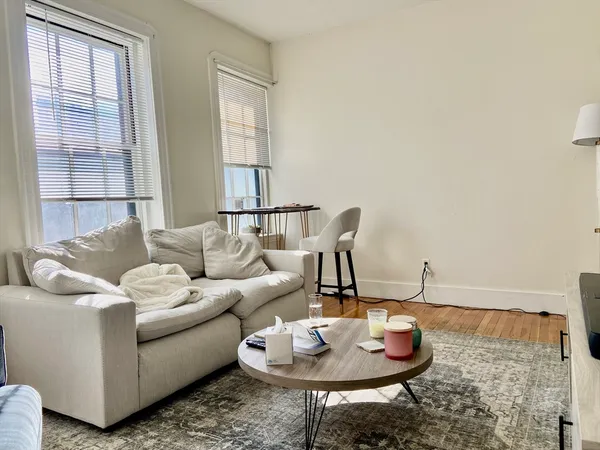 a living room with furniture and a table