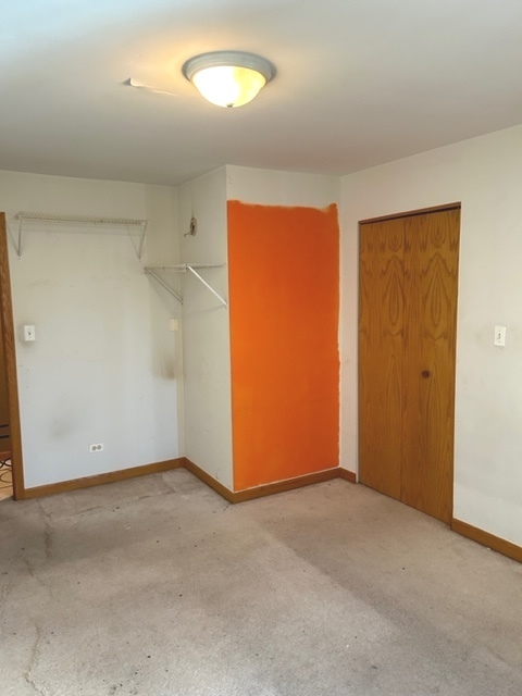 10620 Brooks Lane, Unit 2C2 Chicago Ridge, IL 60415 - Photo 11 of 12 an empty room with windows