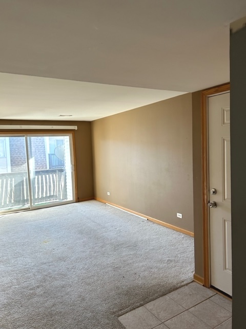 10620 Brooks Lane, Unit 2C2 Chicago Ridge, IL 60415 - Photo 3 of 12 a view of an empty room with a window