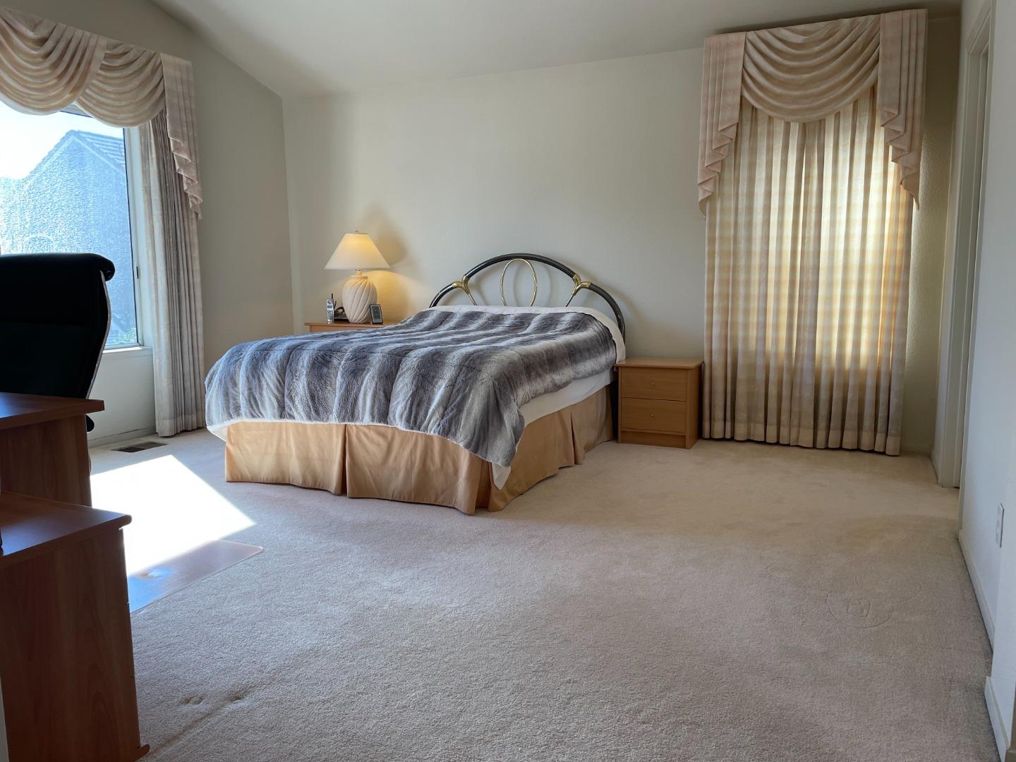 1656 Klipspringer Drive San Jose, CA 95124 - Photo 11 of 19 a spacious bedroom with a bed and a window