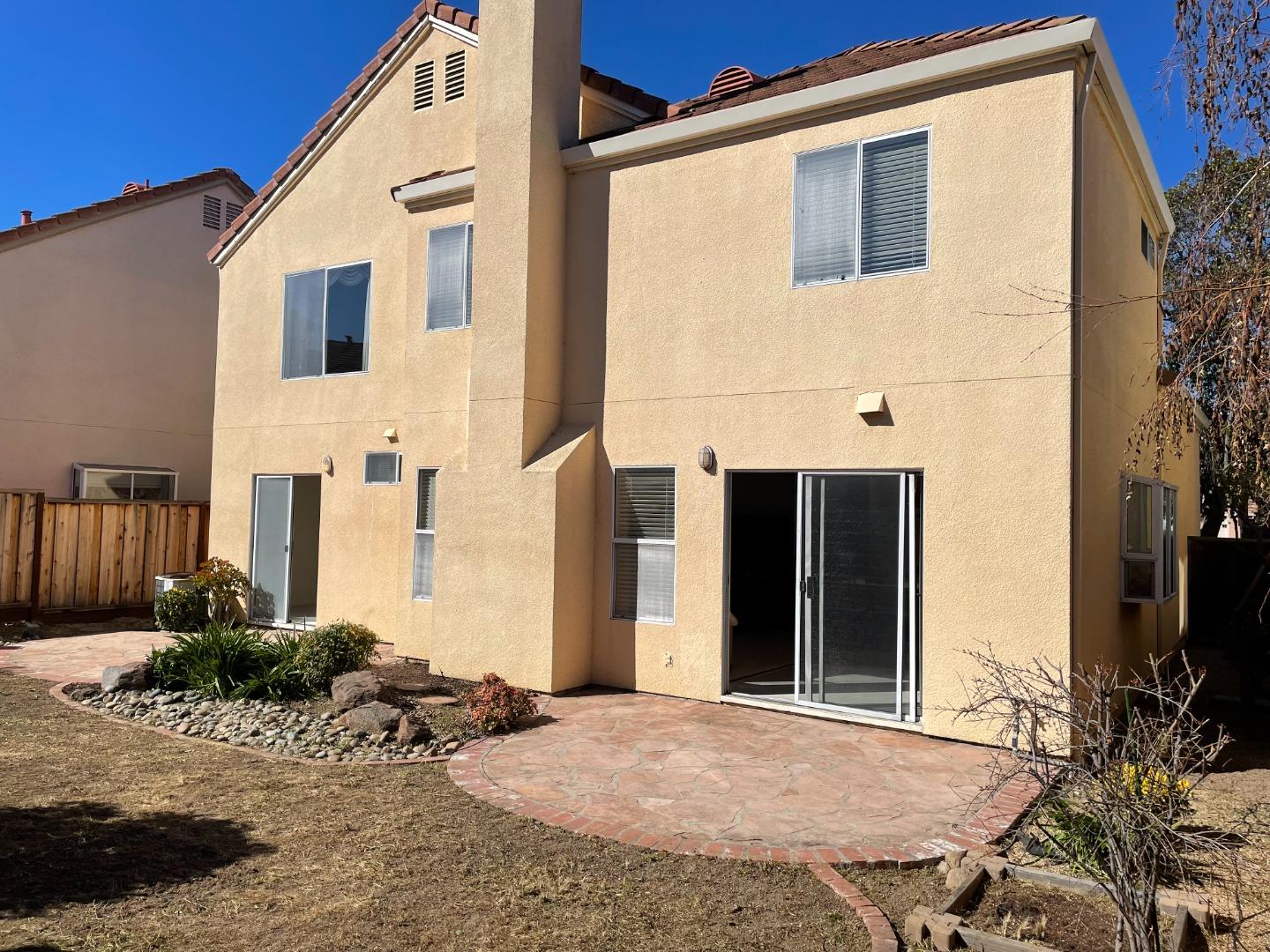 1656 Klipspringer Drive San Jose, CA 95124 - Photo 15 of 19 a view of a house with a wooden door and chair