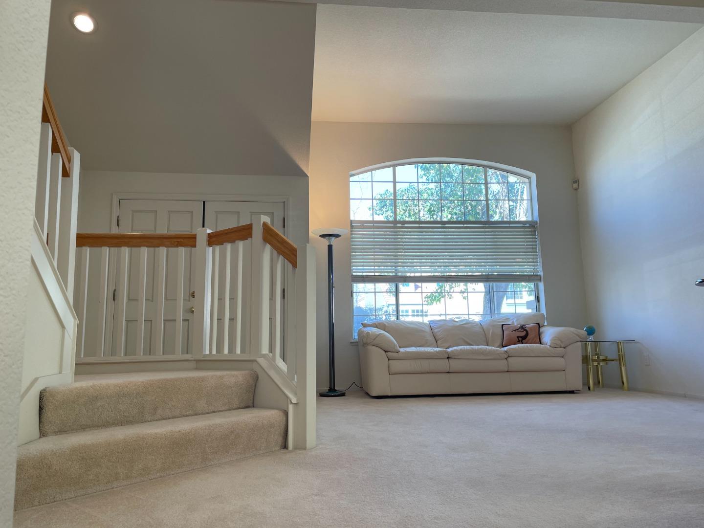 1656 Klipspringer Drive San Jose, CA 95124 - Photo 3 of 19 a living room with a couch and a large window