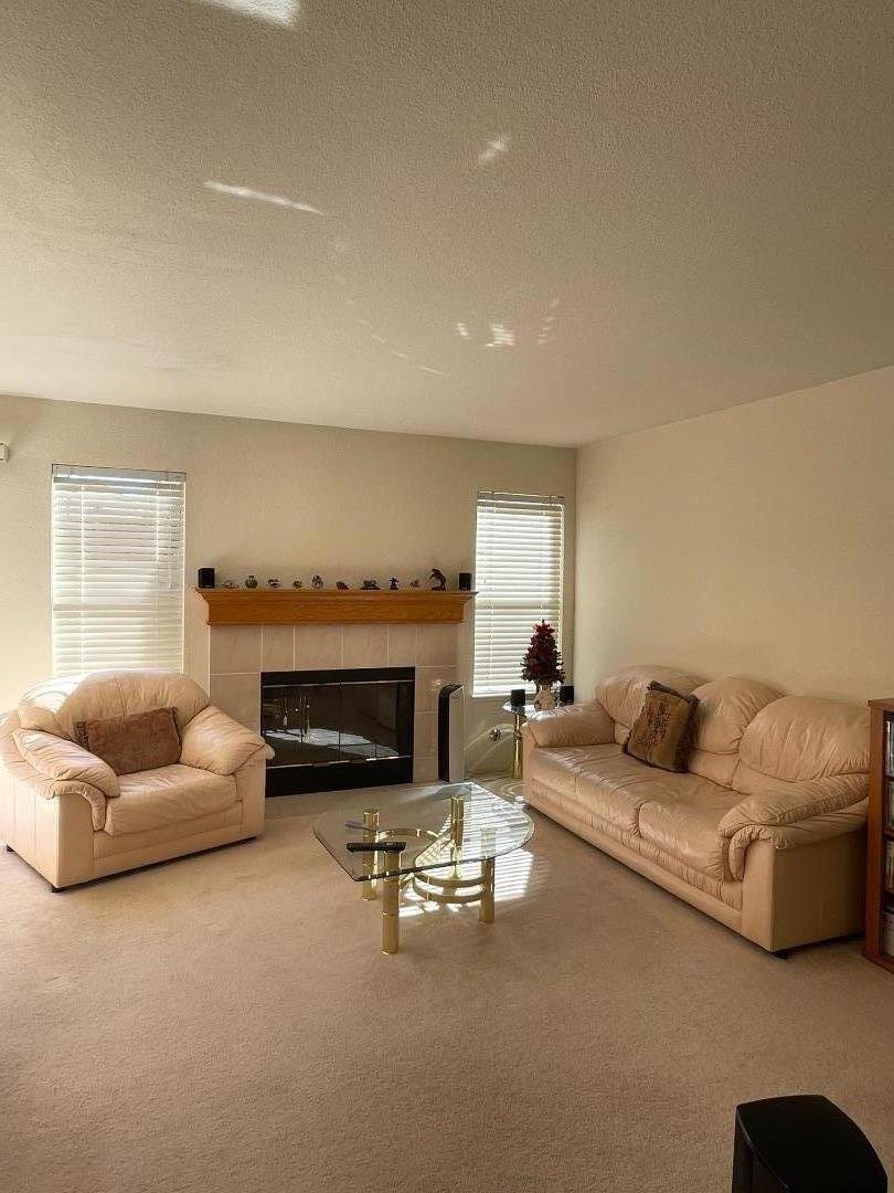 1656 Klipspringer Drive San Jose, CA 95124 - Photo 4 of 19 a living room with furniture and a fireplace