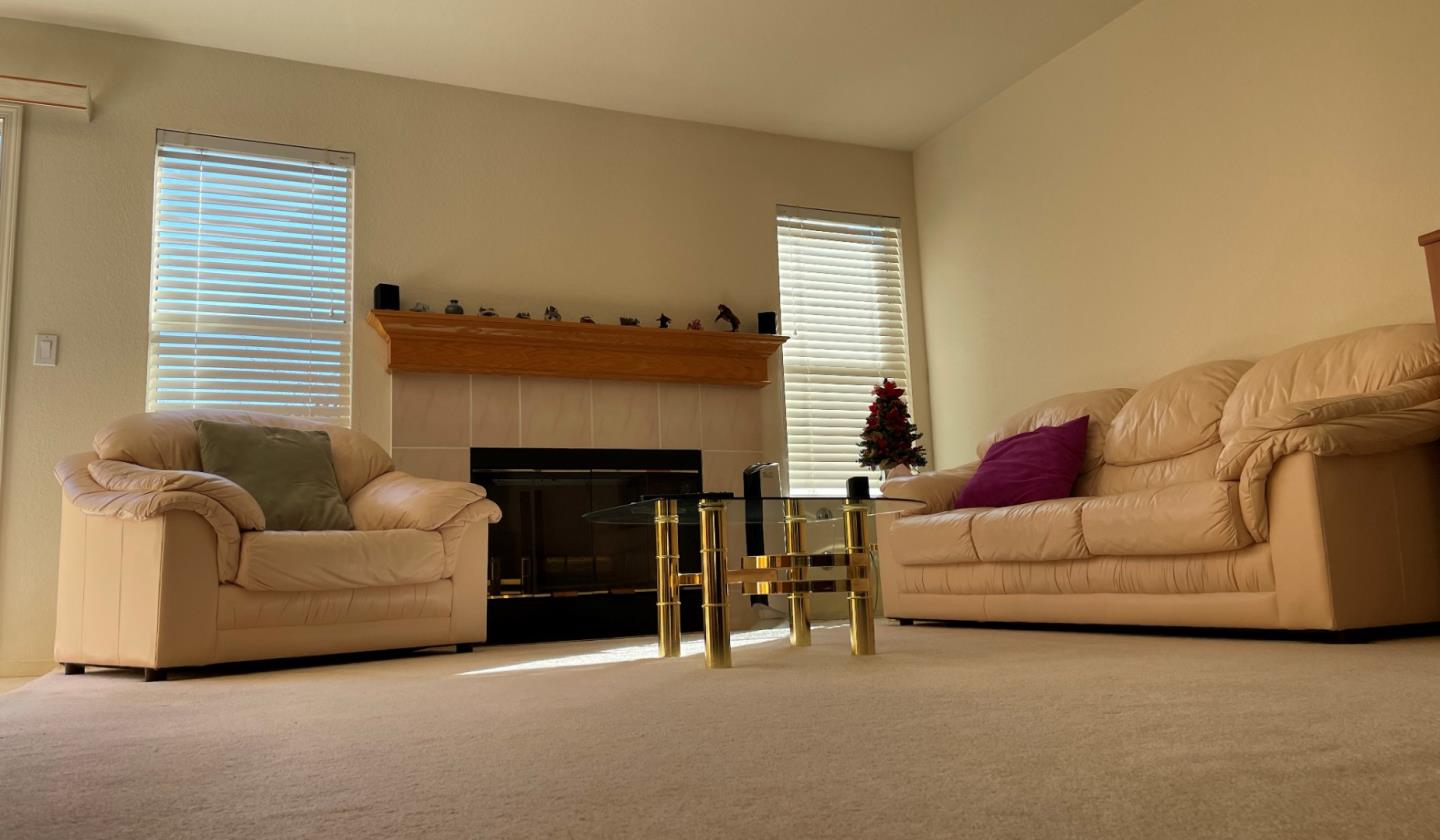 1656 Klipspringer Drive San Jose, CA 95124 - Photo 5 of 19 a living room with furniture and a fireplace