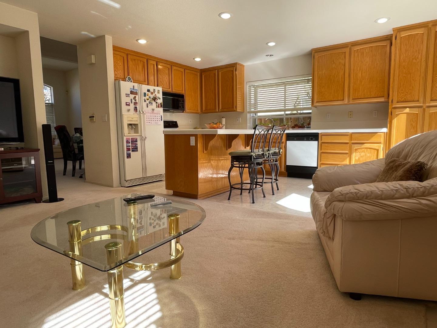 1656 Klipspringer Drive San Jose, CA 95124 - Photo 6 of 19 a room with stainless steel appliances kitchen island granite countertop a refrigerator and a sink