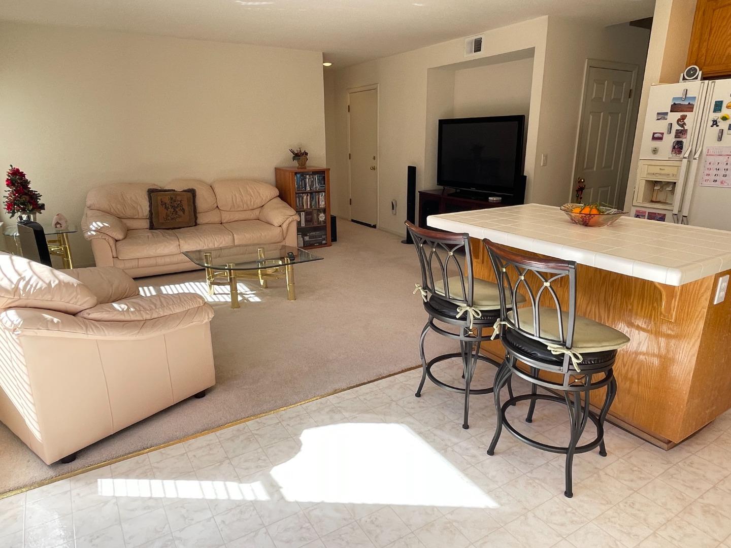 1656 Klipspringer Drive San Jose, CA 95124 - Photo 7 of 19 a living room with furniture and a flat screen tv