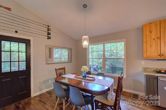 a view of a dining room with furniture window and outside view