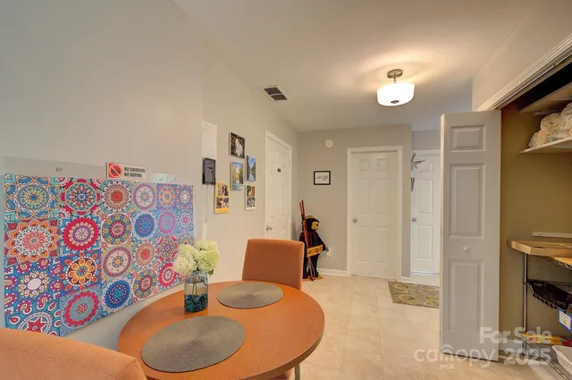 a room with furniture a washer and dryer