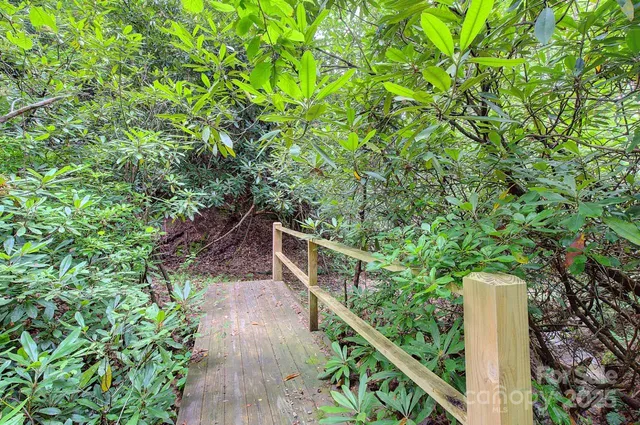 a view of house with a yard
