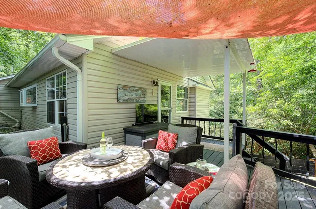 a view of balcony with furniture and outdoor seating