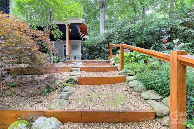 a view of a yard with table and chairs