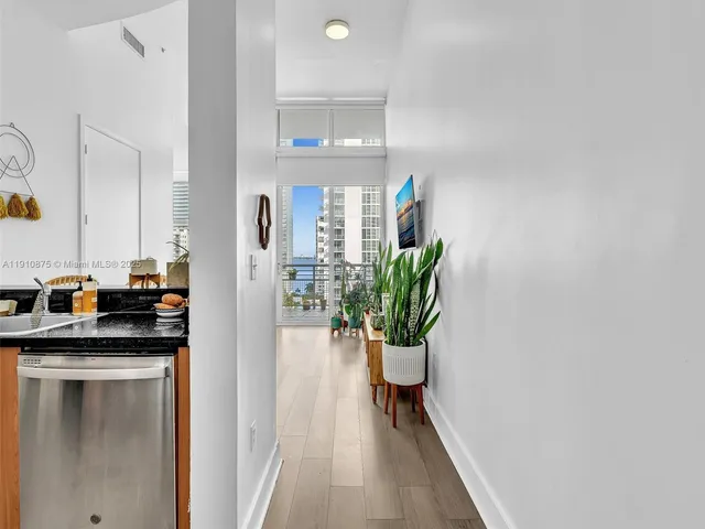 a kitchen with stainless steel appliances granite countertop a refrigerator and a stove