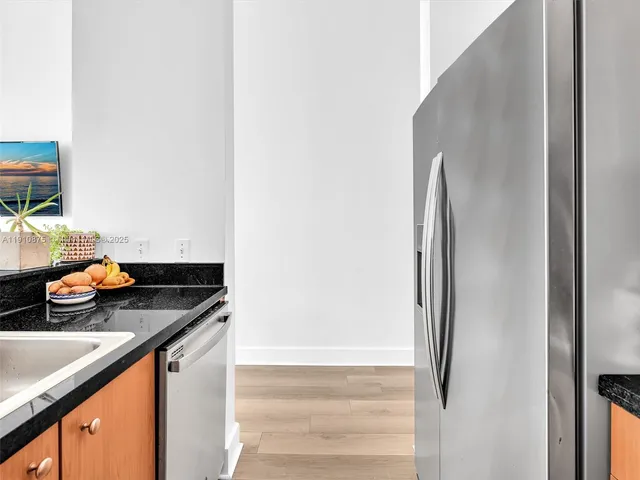 a living room with furniture a large window with wooden floor