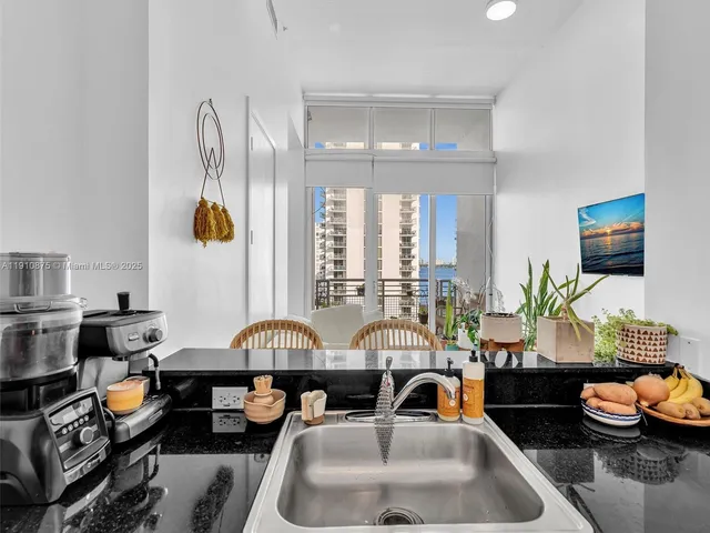 a living room with furniture window and wooden floor
