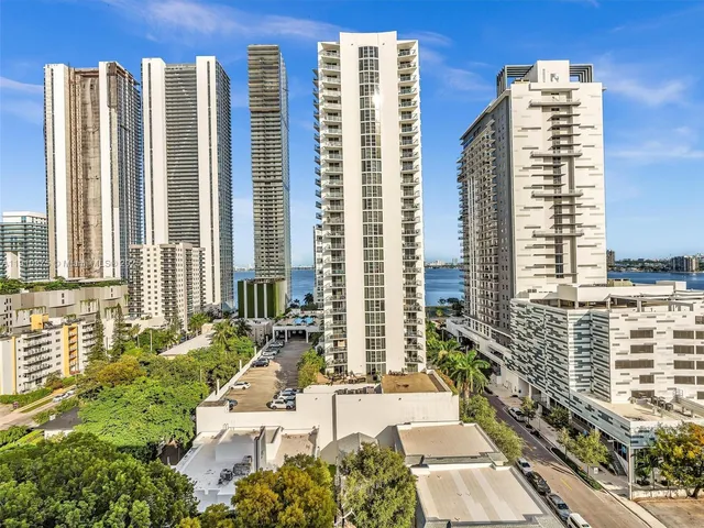 a view of balcony with a couple of flower plants