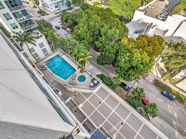 a view of balcony with two chairs and a potted plant