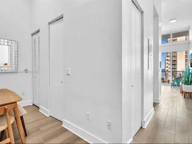 a kitchen with a sink and refrigerator