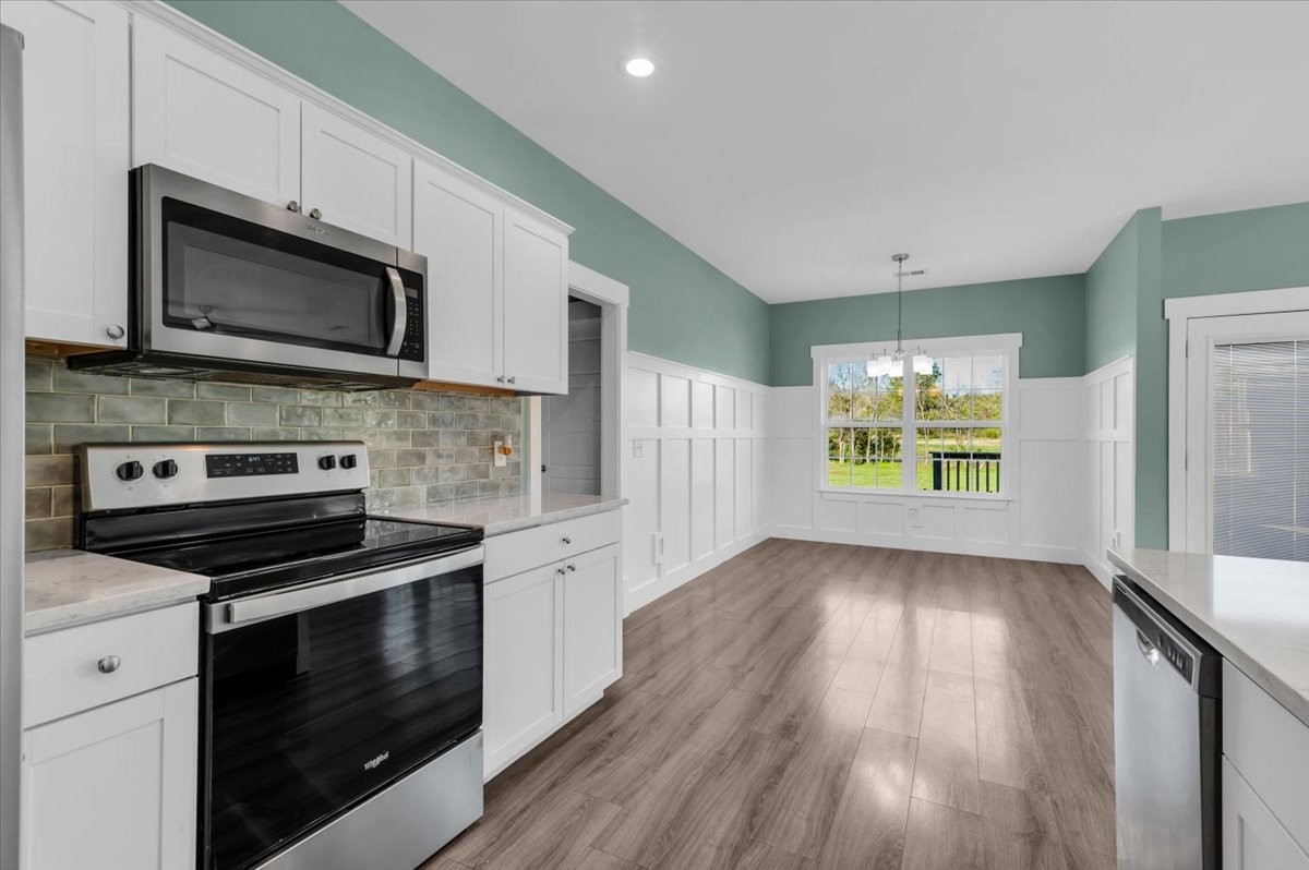 3164 Rucker Road Christiana, TN 37037 - Photo 23 of 67 a kitchen with stainless steel appliances a stove microwave and sink