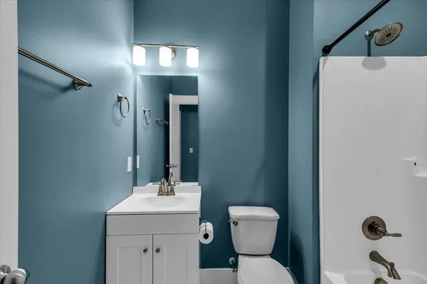 a bathroom with a sink and vanity