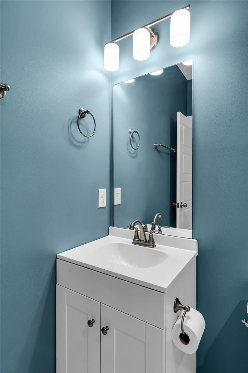 3164 Rucker Road Christiana, TN 37037 - Photo 30 of 67 a bathroom with a sink vanity and a mirror