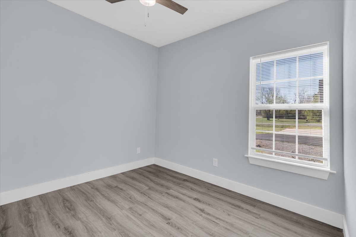 3164 Rucker Road Christiana, TN 37037 - Photo 31 of 67 an empty room with wooden floor and windows
