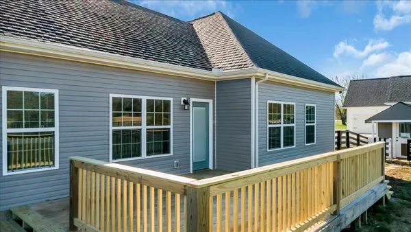 a view of a house with a yard balcony