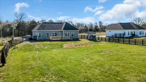 an aerial view of a residential houses with outdoor space