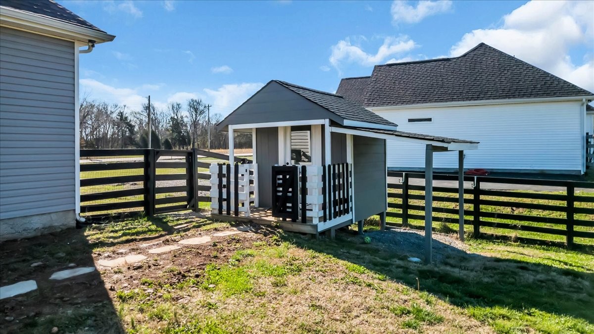 3164 Rucker Road Christiana, TN 37037 - Photo 51 of 67 a view of a house with a small yard and wooden fence