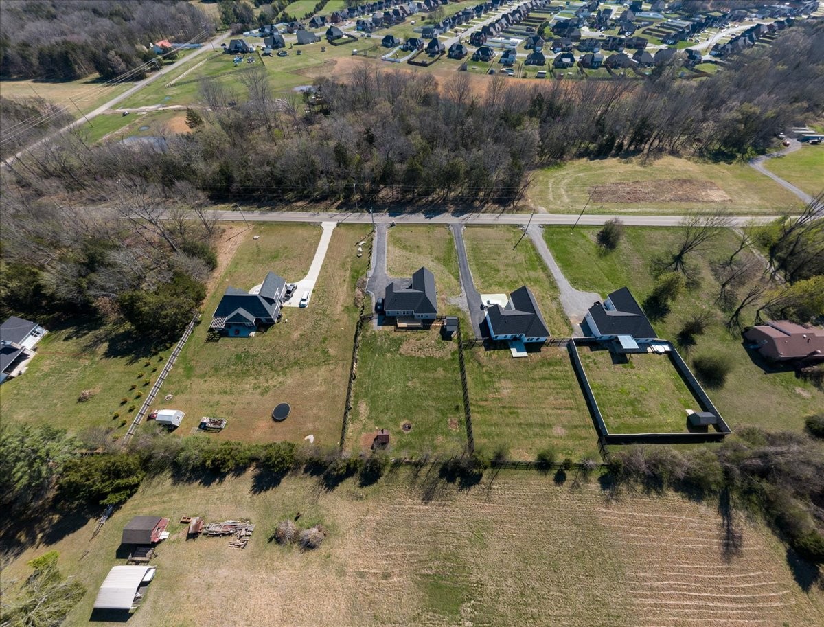 3164 Rucker Road Christiana, TN 37037 - Photo 63 of 67 an aerial view of a swimming pool with a yard and lake view