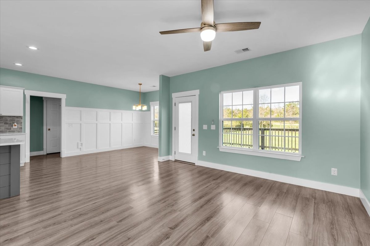 3164 Rucker Road Christiana, TN 37037 - Photo 7 of 67 a view of an empty room with wooden floor and a window