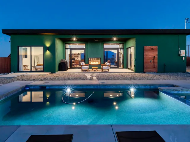 a view of a backyard with sitting area