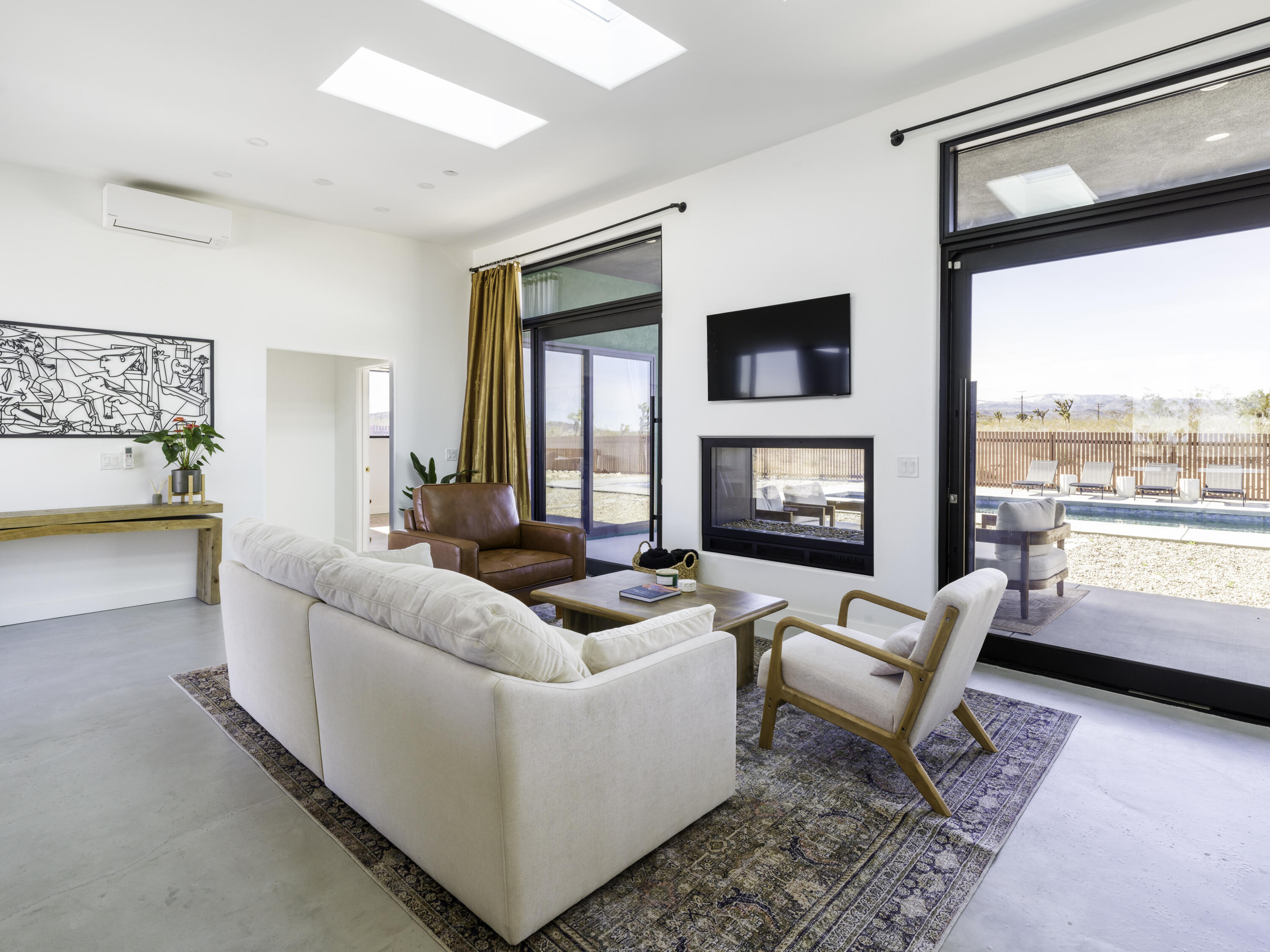 59130 Reche Road Landers, CA 92285 - Photo 11 of 69 a living room with furniture and a flat screen tv