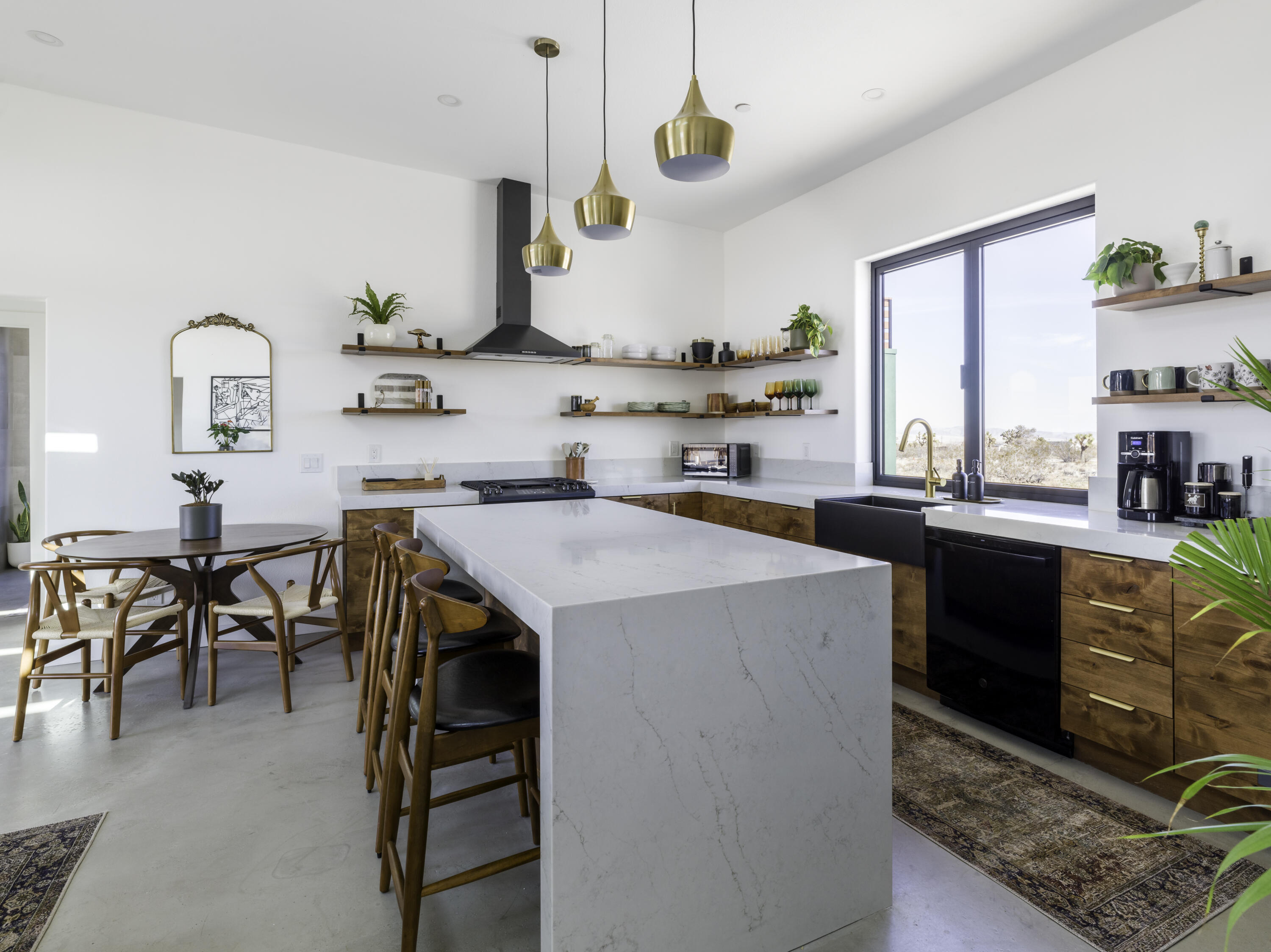 59130 Reche Road Landers, CA 92285 - Photo 12 of 71 a kitchen with a sink a stove and chairs