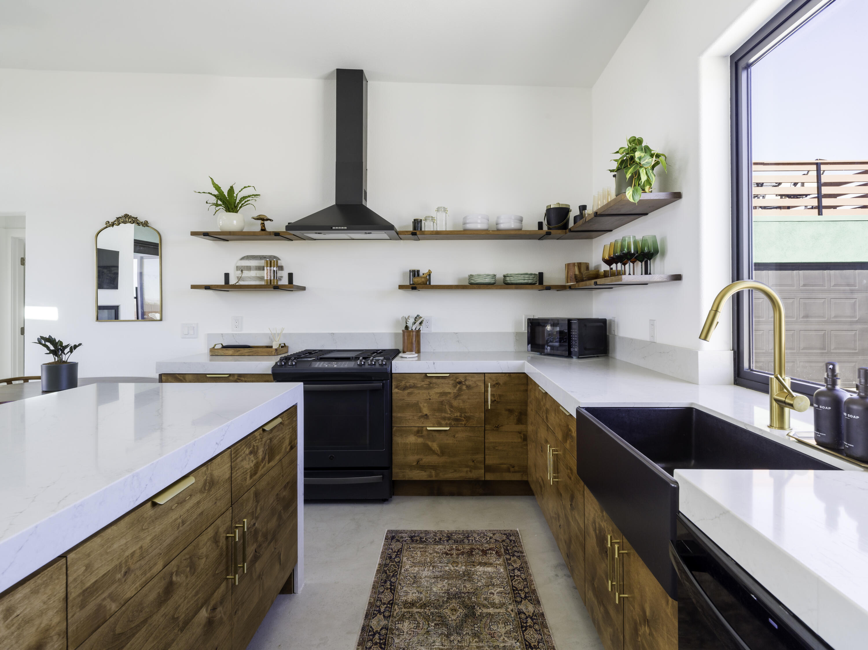 59130 Reche Road Landers, CA 92285 - Photo 13 of 71 a kitchen with stainless steel appliances a sink stove and cabinets