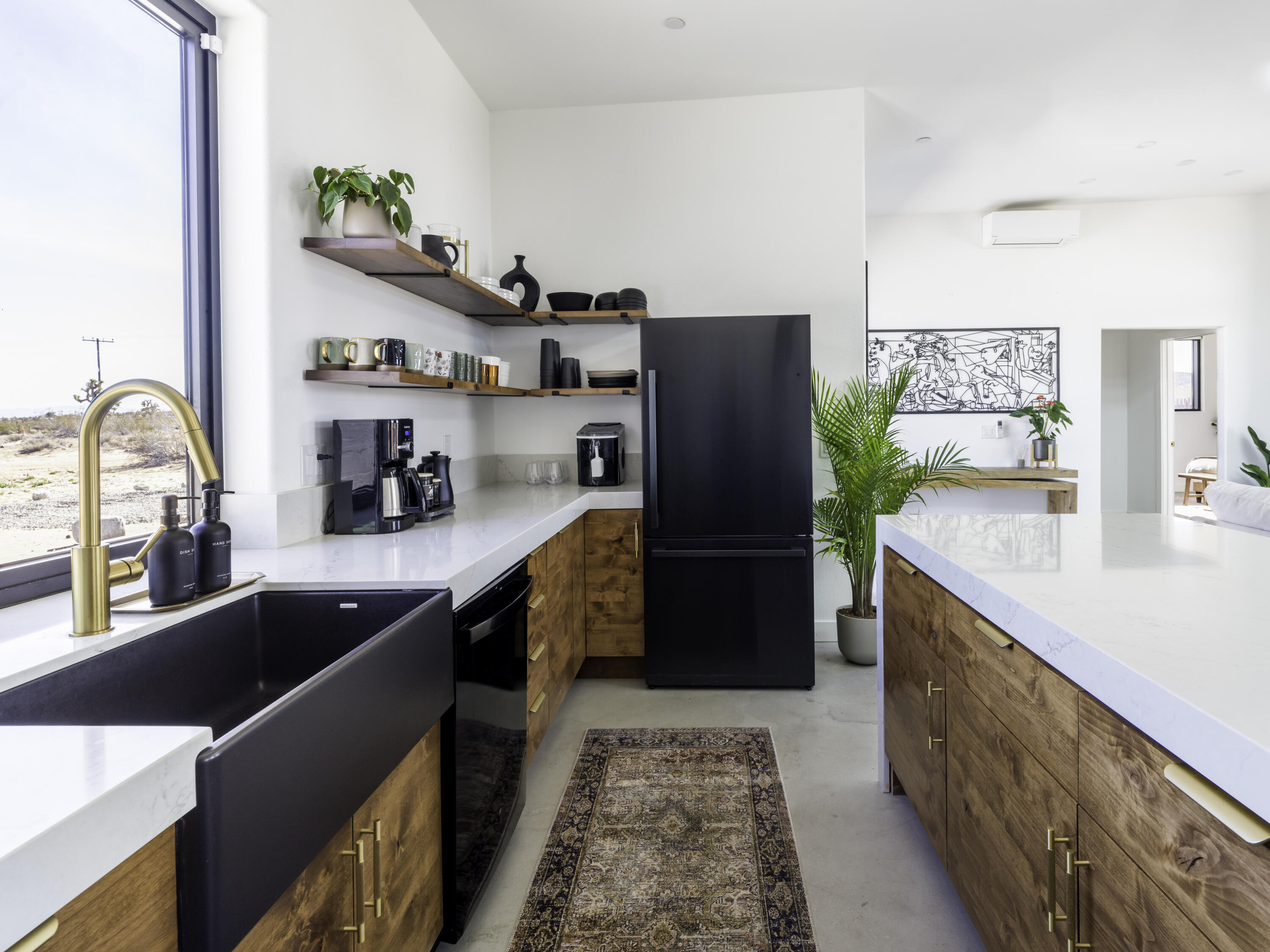 59130 Reche Road Landers, CA 92285 - Photo 13 of 69 a kitchen with stainless steel appliances granite countertop a sink a stove and a refrigerator