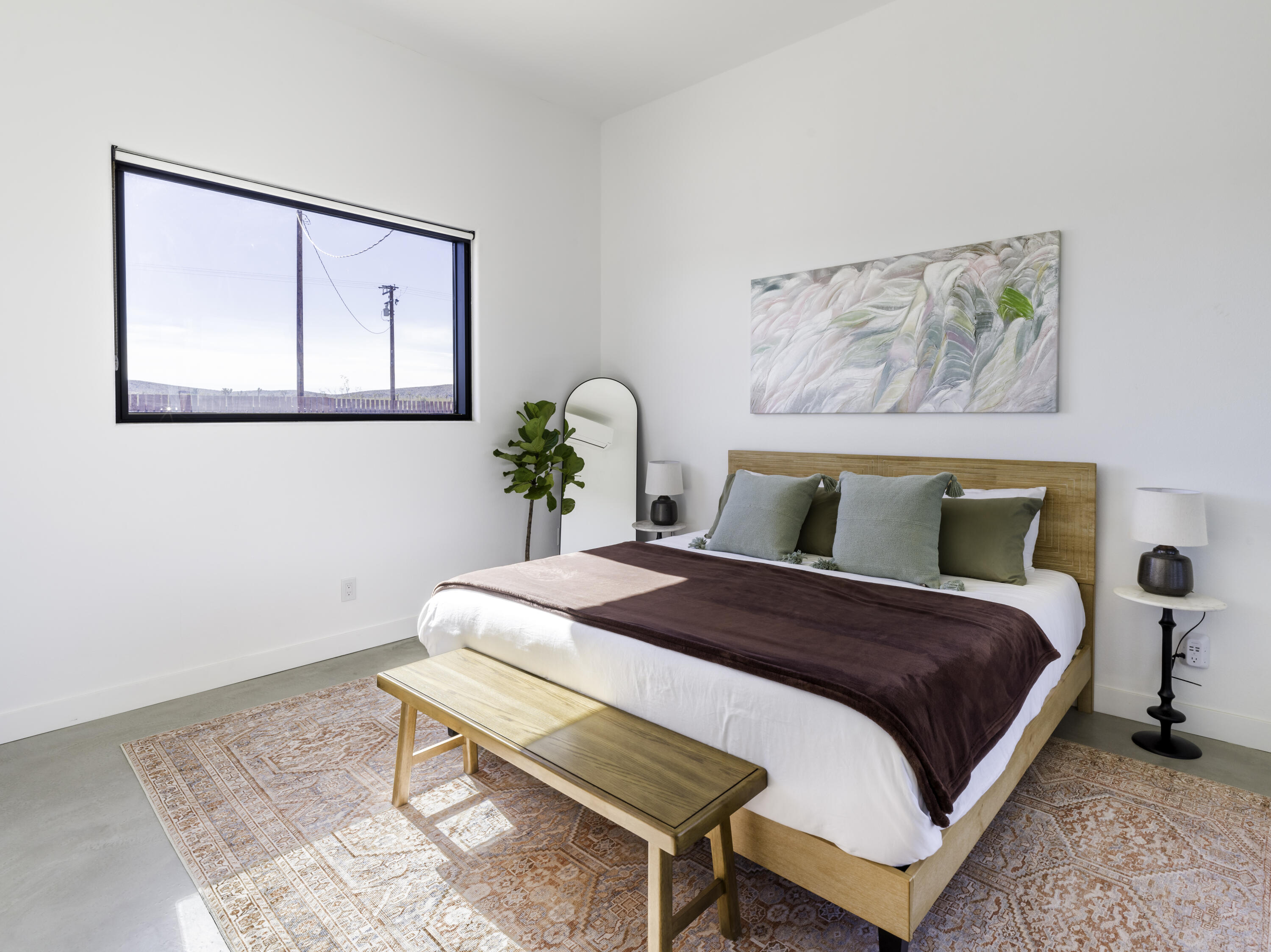 59130 Reche Road Landers, CA 92285 - Photo 20 of 71 a bedroom with a bed table and window