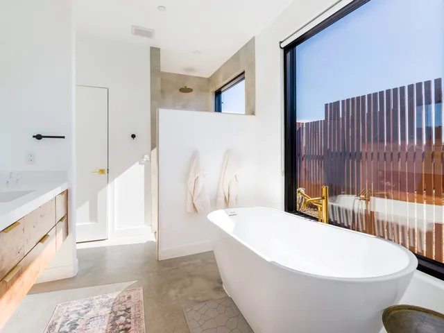 a bedroom with a bed and cabinets