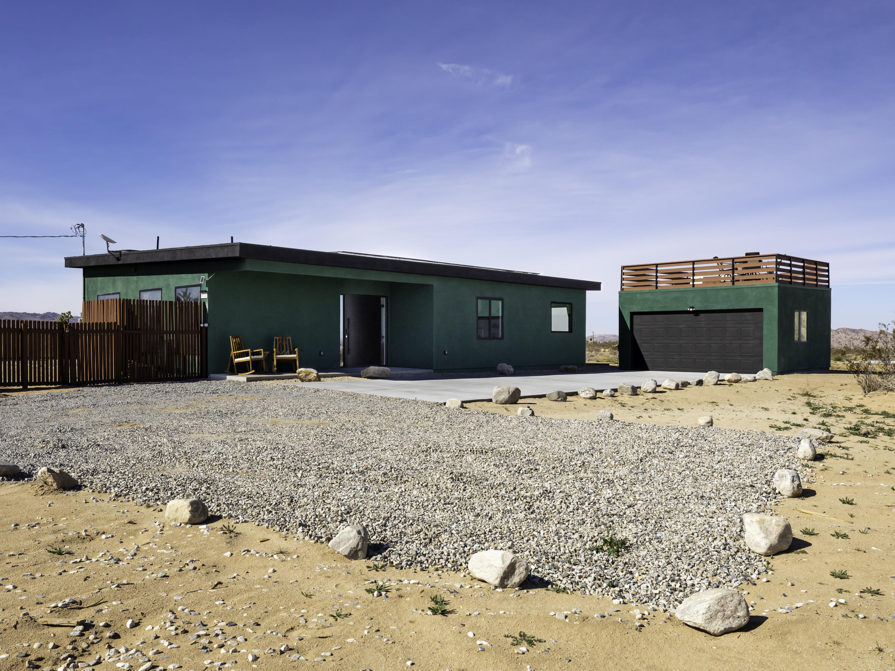 59130 Reche Road Landers, CA 92285 - Photo 3 of 71 a front view of a house with a yard